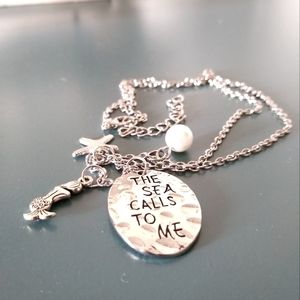 The Sea Calls Me Pendant Necklace Adjustable 20" to 22" long. Silvertone.